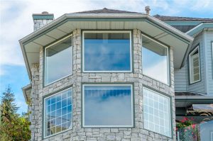 Picture of six windows on a beautiful house.